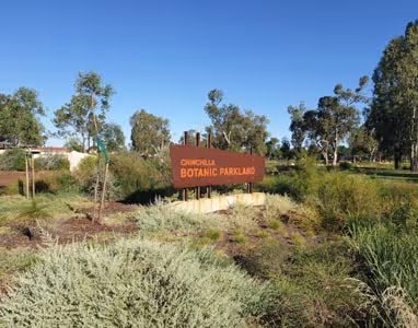 The entrance to the Chinchilla Botanic Gardens with a sign.
